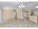 Bright and airy living room with high ceilings, ceiling fan, neutral walls, and tile flooring at 13173 Sw 65Th Cir, Ocala, FL 34473