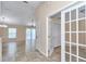 View of the open-concept living room featuring tile flooring and a ceiling fan at 13173 Sw 65Th Cir, Ocala, FL 34473