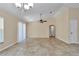 Open living area offering ample space, tile flooring, ceiling fan, and natural light at 13173 Sw 65Th Cir, Ocala, FL 34473