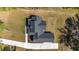 Overhead view of home with landscaping, driveway, and roof at 14115 Nw 141St Ave, Williston, FL 32696