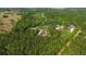 Overhead shot of a modern home surrounded by dense trees, emphasizing its peaceful and private location at 14115 Nw 141St Ave, Williston, FL 32696