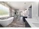 Bright bathroom featuring a modern soaking tub, walk-in shower, and stylish vanity at 14115 Nw 141St Ave, Williston, FL 32696