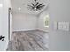 A neutral colored bedroom with gray wood floors and a view of the backyard at 14115 Nw 141St Ave, Williston, FL 32696
