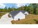 Side of house with AC unit and long driveway at 14115 Nw 141St Ave, Williston, FL 32696