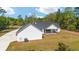 Side of house with AC unit, lawn, and trees at 14115 Nw 141St Ave, Williston, FL 32696
