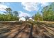 Charming single-story home with a welcoming entrance and well-maintained lawn on a spacious lot surrounded by mature trees at 14115 Nw 141St Ave, Williston, FL 32696