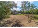 Charming single-story home nestled amidst mature trees, providing a serene and private setting with a natural landscape at 14115 Nw 141St Ave, Williston, FL 32696