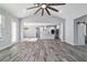 Bright, open-concept living room with wood floors and view of the kitchen at 14115 Nw 141St Ave, Williston, FL 32696