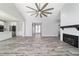 Open-concept home with a kitchen, living room, and fireplace, showcasing modern design elements at 14115 Nw 141St Ave, Williston, FL 32696