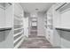 Large walk-in closet with built-in storage and sleek modern design at 14115 Nw 141St Ave, Williston, FL 32696