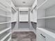 Well-organized walk-in closet featuring custom shelving and hanging rods at 14115 Nw 141St Ave, Williston, FL 32696