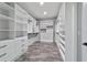 Well-lit walk-in closet boasting custom shelving and ample space for storage at 14115 Nw 141St Ave, Williston, FL 32696
