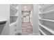 Bright walk-in closet with custom shelving, drawers, and hanging space at 14115 Nw 141St Ave, Williston, FL 32696