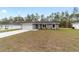 Single Gathering home with a wide driveway, two-car garage, and lush lawn at 15840 Sw 38 Pl, Ocala, FL 34481