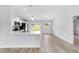 Bright kitchen with stainless appliances, white cabinets, and light wood floors, offering a modern and inviting space at 15854 Sw 38 Pl, Ocala, FL 34481