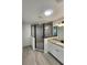 Modern bathroom featuring a tiled shower with sleek glass enclosure, white vanity, and granite countertop at 22764 Sw Sea Cliff Ave, Dunnellon, FL 34431