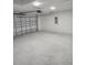 Spacious two-car garage with concrete floor and automatic door at 22764 Sw Sea Cliff Ave, Dunnellon, FL 34431