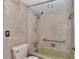Bathroom with mosaic-style tile, green tub, and handrails at 2837 Ne 3Rd St # 103, Ocala, FL 34470