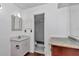 Bright bathroom featuring granite counters, white cabinets, and access to an updated shower at 2837 Ne 3Rd St # 103, Ocala, FL 34470