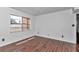 Well-lit bedroom with wood-look flooring and a large window provides a warm and inviting space at 2837 Ne 3Rd St # 103, Ocala, FL 34470