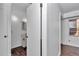 Hallway featuring hardwood floors and a bathroom at 2837 Ne 3Rd St # 103, Ocala, FL 34470