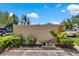 Lush landscaping complements this home's exterior with mature trees and healthy green foliage at 2837 Ne 3Rd St # 103, Ocala, FL 34470