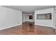 Bright living room featuring hardwood floors and a pass-through to the kitchen area at 2837 Ne 3Rd St # 103, Ocala, FL 34470