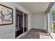 Enclosed sunroom with tile flooring and sliding door offers a bright and versatile living space at 2837 Ne 3Rd St # 103, Ocala, FL 34470