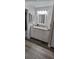Bright bathroom featuring white cabinets, granite countertop, and modern lighting at 2843 Ne 3Rd St # 109, Ocala, FL 34470