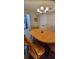 Dining room features a dining table, chandelier, and neutral paint colors at 2843 Ne 3Rd St # 109, Ocala, FL 34470