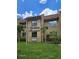 Well-maintained exterior view of a condo building featuring manicured landscaping at 2843 Ne 3Rd St # 109, Ocala, FL 34470