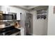 Modern kitchen featuring stainless steel appliances and bright, white cabinetry at 2843 Ne 3Rd St # 109, Ocala, FL 34470