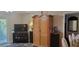 Living room featuring a large wooden armoire and television set, creating a comfortable entertainment space at 2843 Ne 3Rd St # 109, Ocala, FL 34470