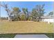 A large backyard provides ample room for outdoor activities and landscaping at 4073 Se 136Th Pl, Summerfield, FL 34491