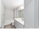Bathroom features a vanity with sink and brushed metal fixtures, a toilet, and a shower-tub combo at 4073 Se 136Th Pl, Summerfield, FL 34491