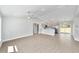 Open concept living space featuring wood-look floors and stainless steel appliances at 4073 Se 136Th Pl, Summerfield, FL 34491