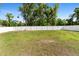 Expansive back yard is enclosed by a pristine white fence, ensuring privacy and security at 4243 Se 131St Ln, Belleview, FL 34420