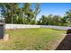 Large backyard features well-maintained grass, a white privacy fence, and plenty of space for recreation at 4243 Se 131St Ln, Belleview, FL 34420