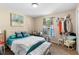 Cozy bedroom featuring carpet floors, a window view, and plenty of room for decorative items at 4243 Se 131St Ln, Belleview, FL 34420