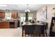 Dining area with a chandelier, bar area, sliding glass doors to the backyard, and tile flooring at 4243 Se 131St Ln, Belleview, FL 34420