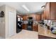 Kitchen features granite countertops, plenty of cabinet space, and modern black appliances at 4243 Se 131St Ln, Belleview, FL 34420