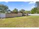 Spacious backyard with green lawn and partial fencing offers privacy and a pleasant outdoor space at 4410 Ne 13Th St, Ocala, FL 34470