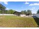 Large backyard with a rectangular in-ground pool and partial fence at 4410 Ne 13Th St, Ocala, FL 34470
