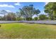 Large, well-manicured backyard enclosed by a white picket fence at 4410 Ne 13Th St, Ocala, FL 34470