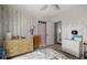 Cozy bedroom featuring two dressers, closet, and comfortable decor at 4410 Ne 13Th St, Ocala, FL 34470