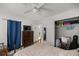 Spacious bedroom featuring a dresser, TV, closet and ceiling fan at 4410 Ne 13Th St, Ocala, FL 34470