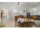 Bright dining area with a table set for four, connected to the living area and kitchen, perfect for gatherings at 4410 Ne 13Th St, Ocala, FL 34470