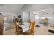 Open concept dining area connected to the kitchen, featuring a dining table and seamless flow for entertaining at 4410 Ne 13Th St, Ocala, FL 34470