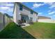 View of spacious backyard with lush lawn, patio area, and privacy fence at 4806 Sw 86Th Ln, Ocala, FL 34476