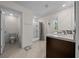 Well-lit bathroom showcasing a shower, vanity, and a separate toilet area for added privacy at 4806 Sw 86Th Ln, Ocala, FL 34476